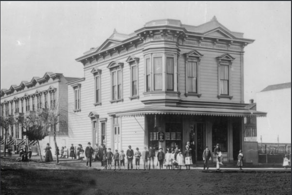Black-and-white photo of the dirt intersection of 20th and Shotwell Streets in February 1897, viewed from Shotwell's building